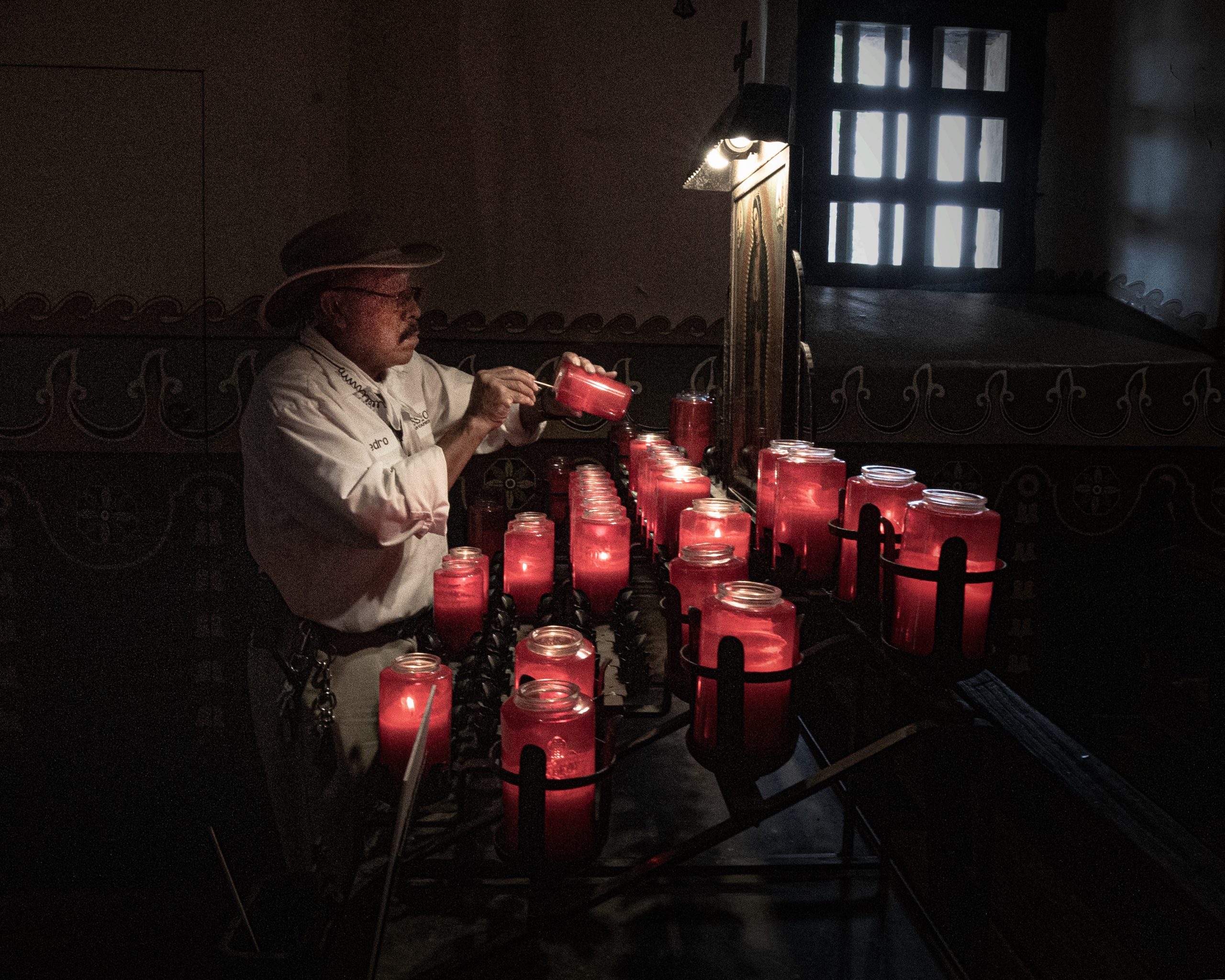 lighting candles by Clestian Andrieux