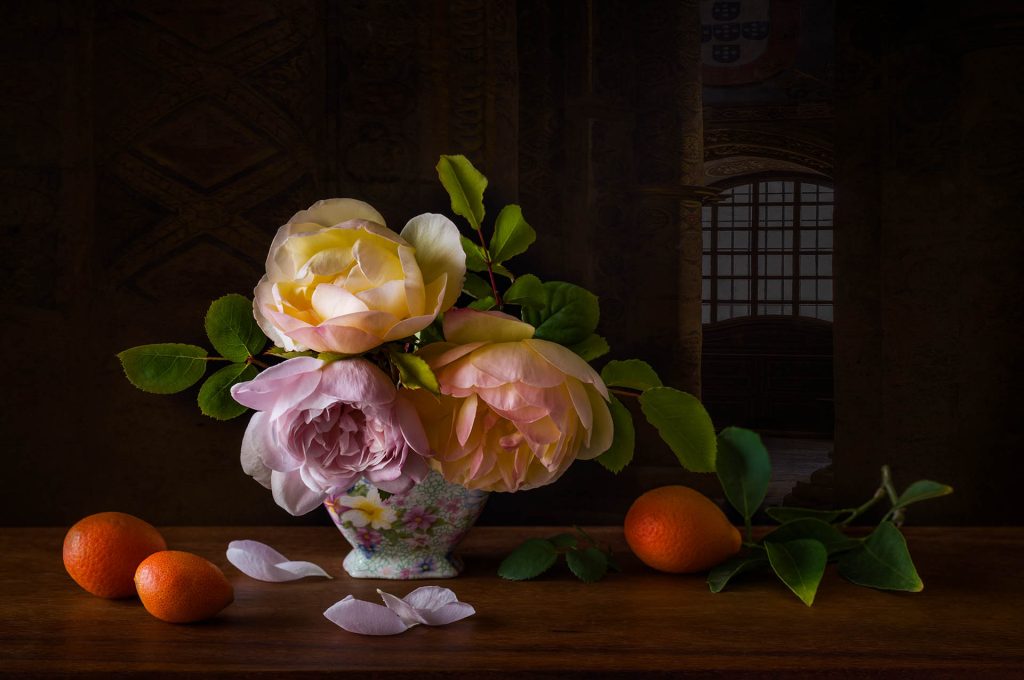 Still life of roses in a glass bowl with oranges
Time Watches as Petals Fall by Lisa Miller